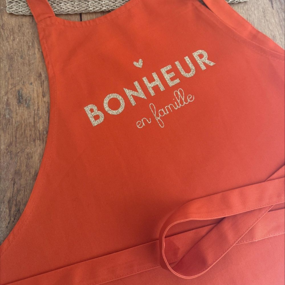 Tablier - mandarine -  Le bonheur en famille