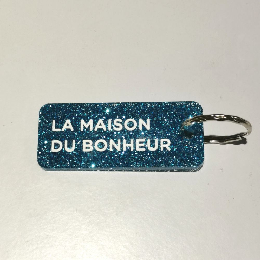 Porte-clés à paillettes - bleu - La maison du bonheur
